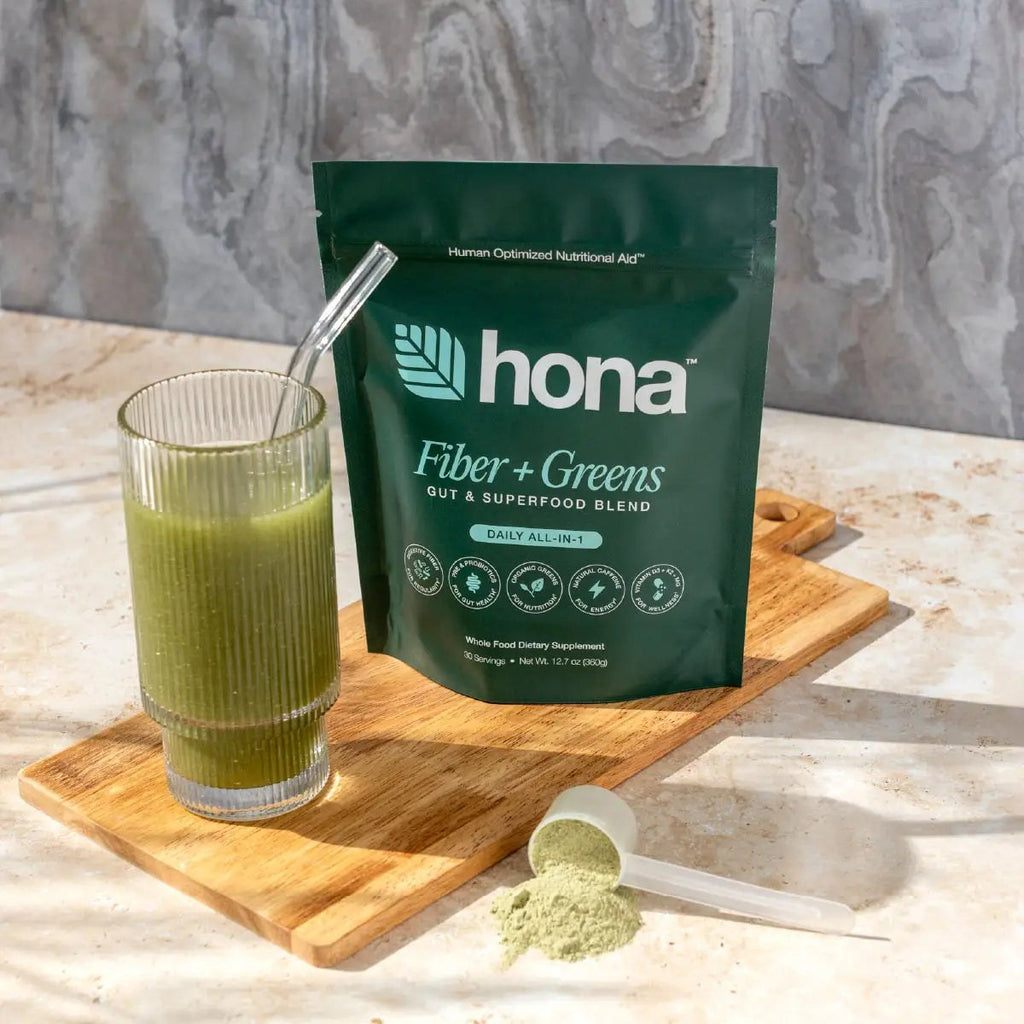 Hona Fiber + Greens scoop next to a prepared glass